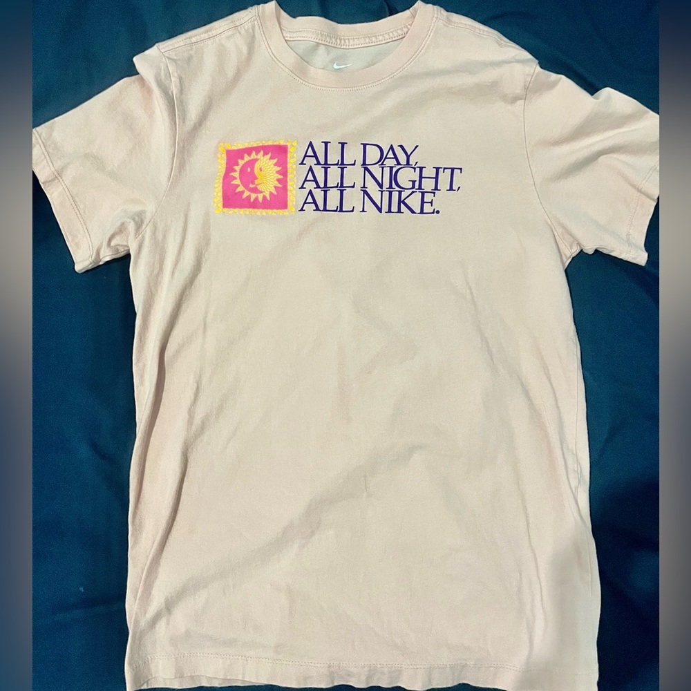 Pink NIKE T-shirt with text print